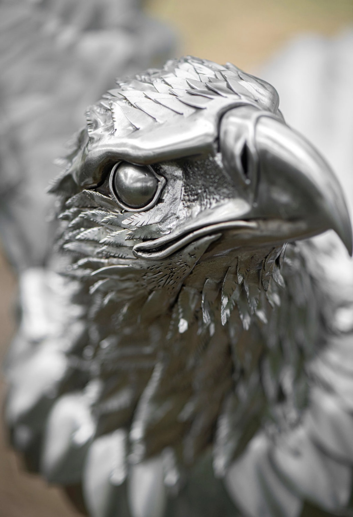 Close-up of the polished stainless steel feathers on the eagle's head